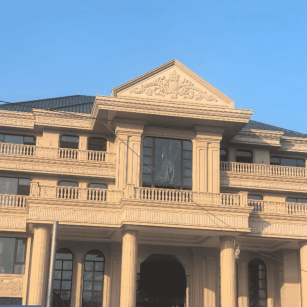 内江黄金麻别墅外墙干挂石材效果示例